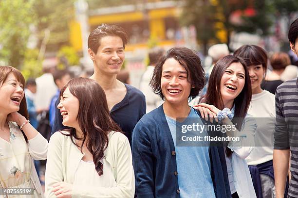 happy japanese friends - guy girl street laugh stock pictures, royalty-free photos & images