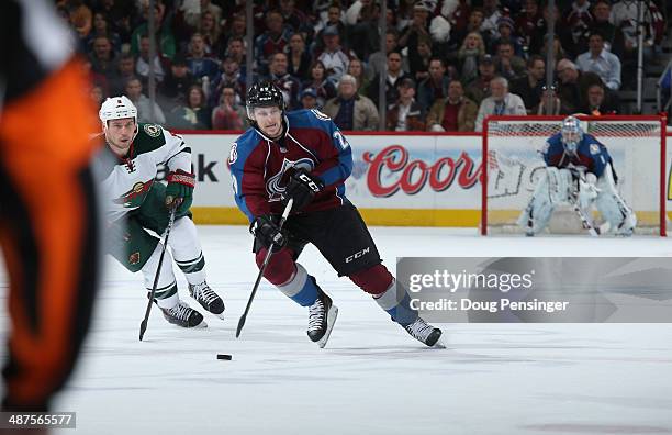 Nathan MacKinnon of the Colorado Avalanche controls the puck against the Minnesota Wild in Game Seven of the First Round of the 2014 NHL Stanley Cup...