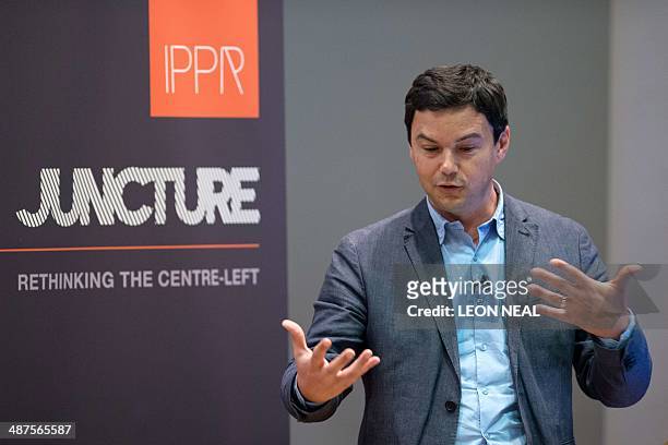 French economist Thomas Piketty speaks to students and guests during a presentation at King's College, central London, on April 30, 2014. Piketty...