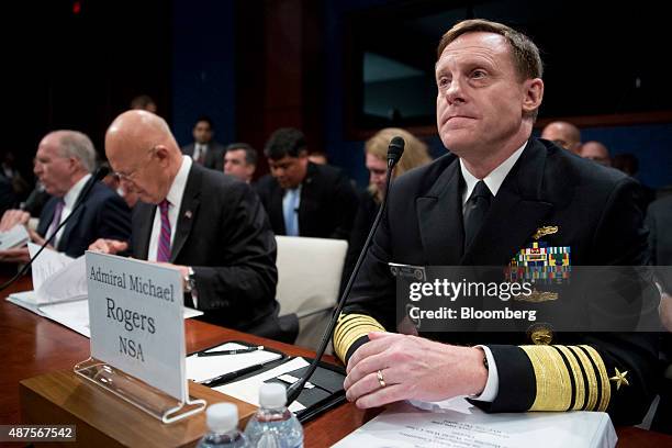 Admiral Michael Rogers, director of the National Security Agency , right, arrives to a House Intelligence Committee hearing with John Brennan,...