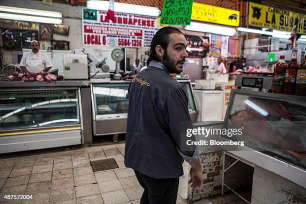 David Barquet, owner and chef of the Camello Gitano Lebanese food truck, shops at a local market before going to his truck at the Street Food Center...