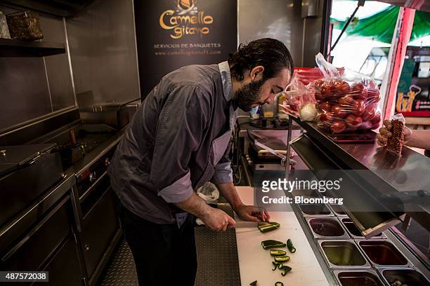 David Barquet, owner and chef of the Camello Gitano Lebanese food truck, prepares a salsa chile at the Street Food Center in a park in the Roma...