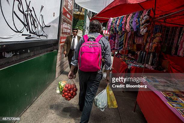 David Barquet, owner and chef of the Camello Gitano Lebanese food truck, arrives for work with ingredients bought at a local market at the Street...