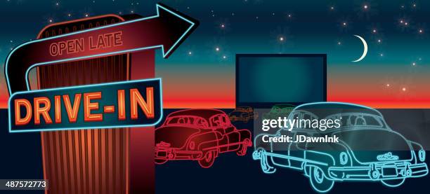 classic drive-in theatre with cars and  neon sign - the art of being obscured stock illustrations