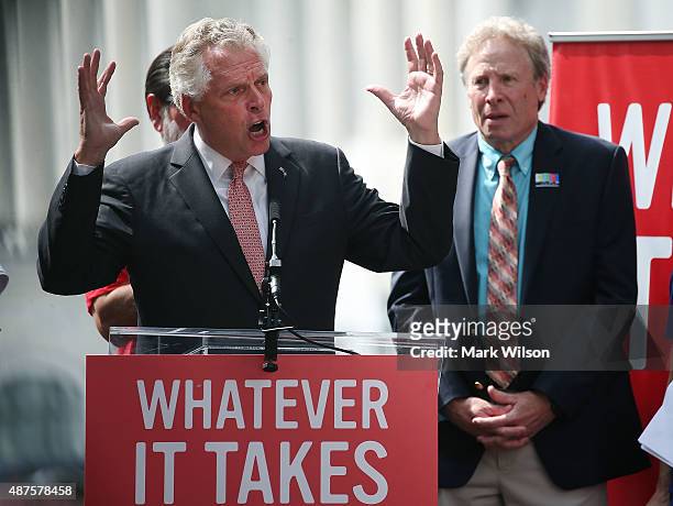 Virginia Governor Terry McAuliffe , speaks while flanked by Andy Parker , father of murdered TV reporter Alison Parker, during a anti gun rally on...