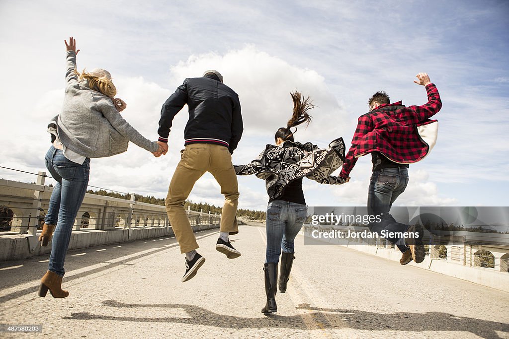 Friends leaping for fun.