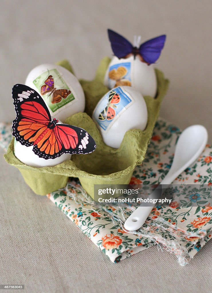 Easter eggs decorated with butterfly stamps