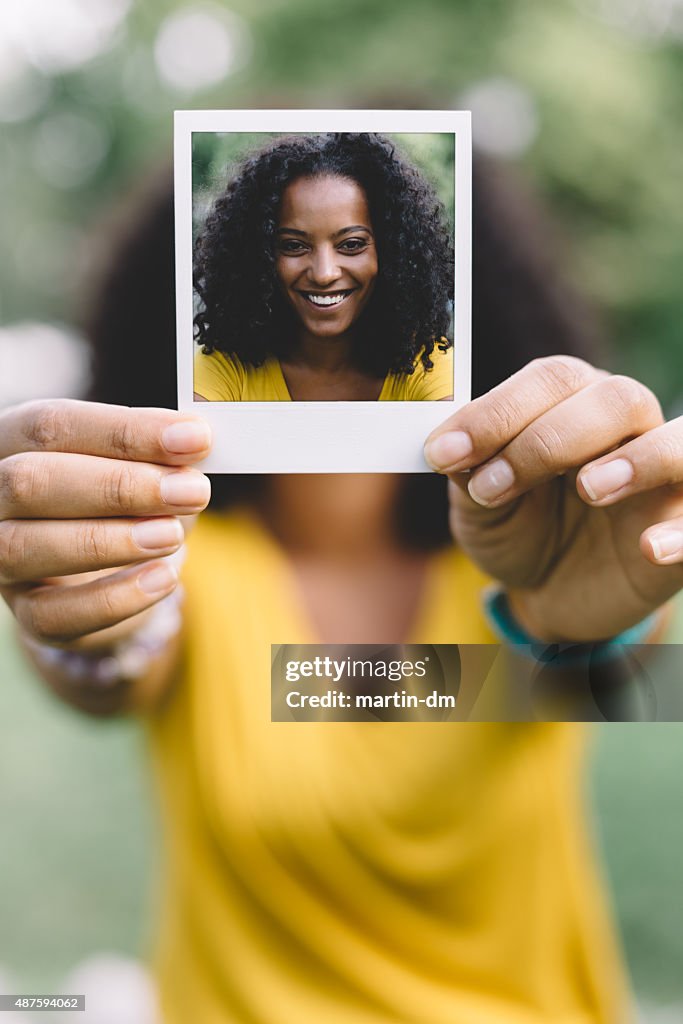 Smiling woman showing selfie