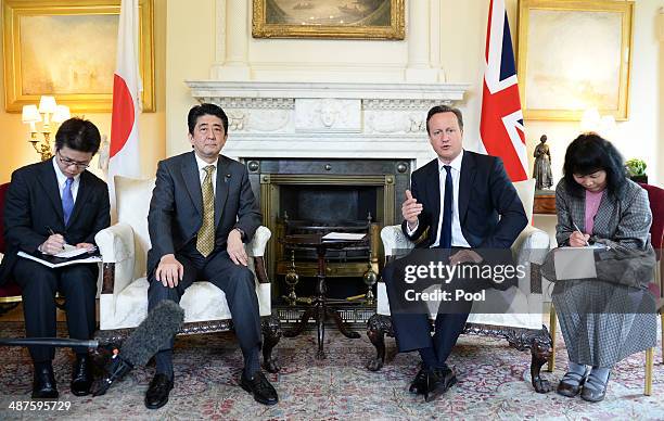 British Prime Minister David Cameron welcomes the Prime Minister of Japan Shinzo Abe to 10 Downing Street on May 1, 2014 in London, England.