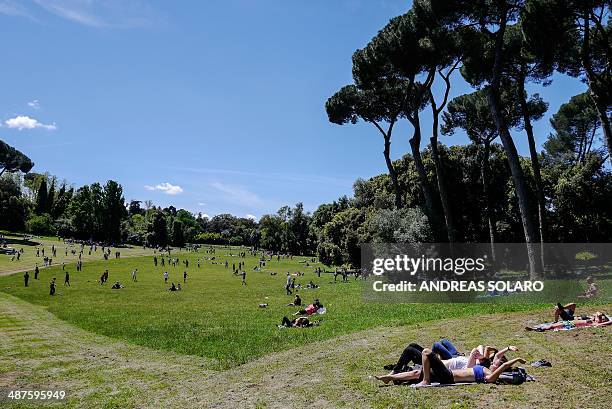 People enjoy a sunny day at the Villa Ada park in Rome, on May 1st, 2014. Many people in Italy spend Labor Day, also known as La Festa dei Lavoratori...