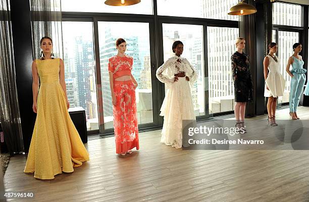 Models wearing John Paul Ataker pose during A Taste Of John Paul Ataker Presentation Spring 2016 New York Fashion Week at The Skylark on September...