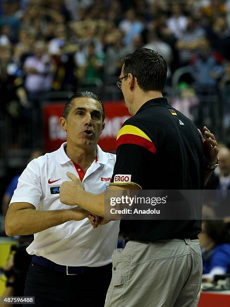 Head coach of Spain Sergio Scariolo talks to head coach of Germany Chris Fleming during the EuroBasket 2015 Group B basketball match between Germany...