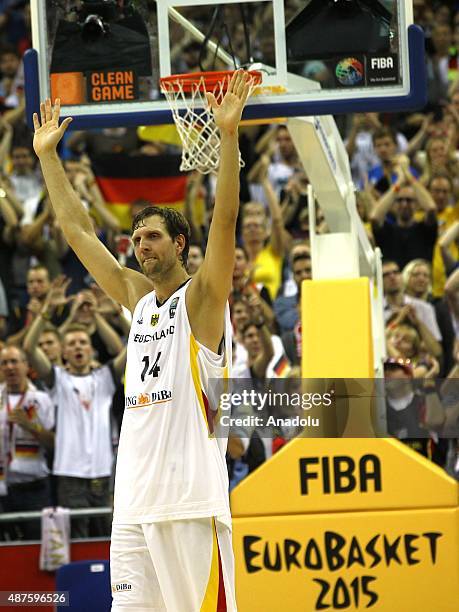 Dirk Nowitzki of Germany greets supporters at the EuroBasket 2015 Group B basketball match between Germany and Spain at Mercedes Benz Arena in...