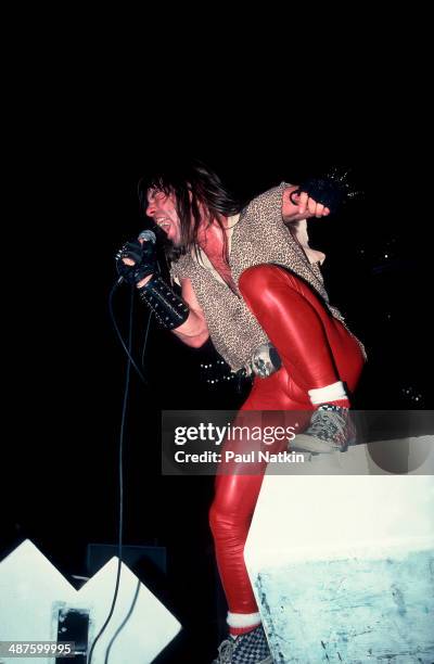 British musician Bruce Dickinson, vocalist for the band Iron Maiden, performs onstage at the University of Illinois Pavilion, Chicago, Illinois,...