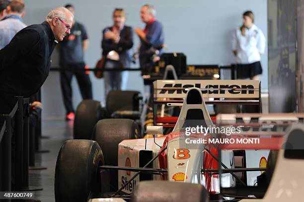 People visit an exhibition which pays tribute to Brazilian's F1 driver Ayrton Senna during a ceremony to commemorate the 20th anniversary of his...