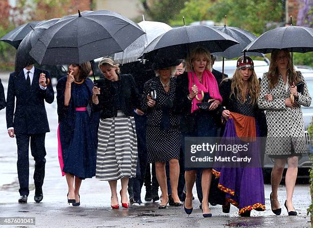 Annabel Elliot, Mark Shand's daughter Ayesha Shand and Katie Elliot lead others including Camilla, Duchess of Cornwall, as they arrive at Holy...