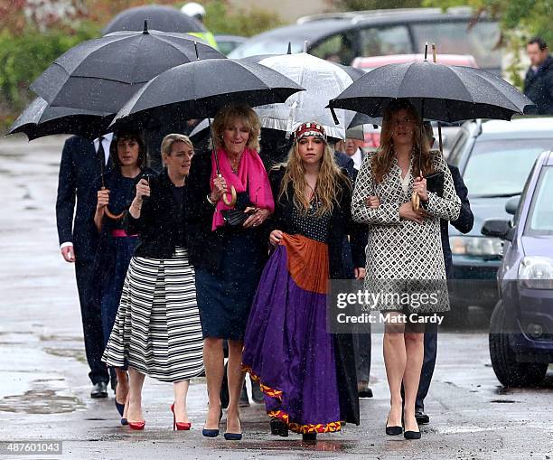 Annabel Elliot, Mark Shand's daughter Ayesha Shand and Katie Elliot arrive at Holy Trinity Church for the funeral of Mark Shand in Stourpaine on May...