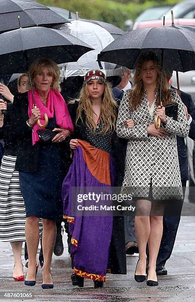 Annabel Elliot, Mark Shand's daughter Ayesha Shand and Katie Elliot arrive at Holy Trinity Church for the funeral of Mark Shand in Stourpaine on May...