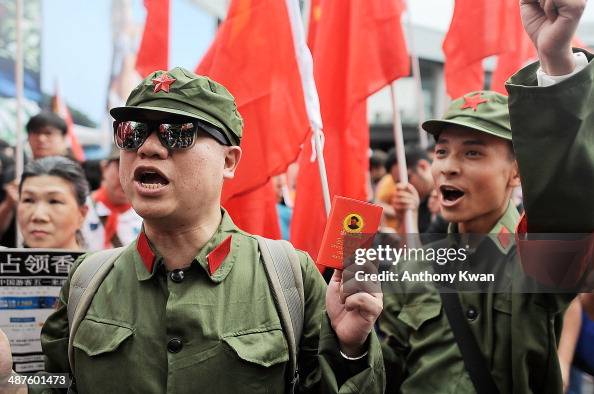 Chinese Rallies Protesters dressed as a Chinese Red Guards chant during a rally on ...