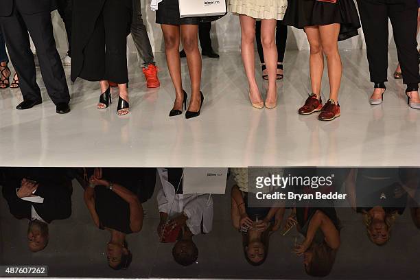 Guests' reflections are seen on the runway at the Josie Natori presentation during Spring 2016 New York Fashion Week: The Shows at Skylight at...