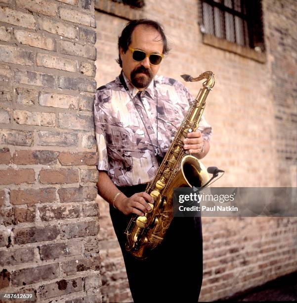Portrait of American jazz musician Joe Lovano as he poses with his saxophone, Chicago, Illinois, September 21, 1991.