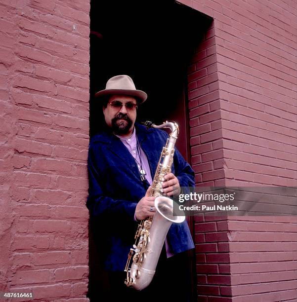 Portrait of American jazz musician Joe Lovano as he poses with his saxophone, Chicago, Illinois, March 21, 2001.