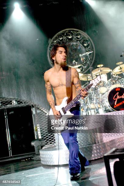 American musician Dave Navarro, guitarist for the band Jane's Addiction, performs onstage, Milwaukee, Wisconsin, July 11, 2003.