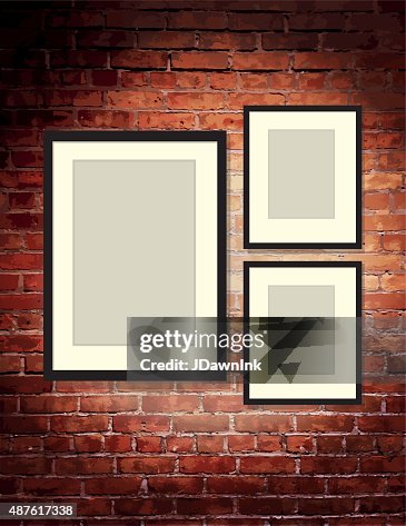 Vertical brick wall background with three blank frames art gallery Vertical brick wall background with three blank frames art gallery