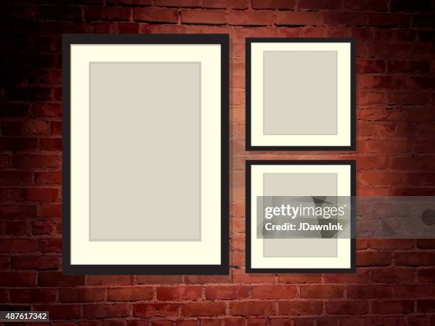 rustic old fashioned brick wall background with three blank frames - art show stock illustrations