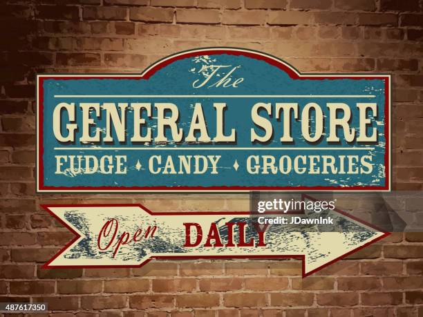 vintage wooden general store signage on yellow brick wall - country and western music stock illustrations