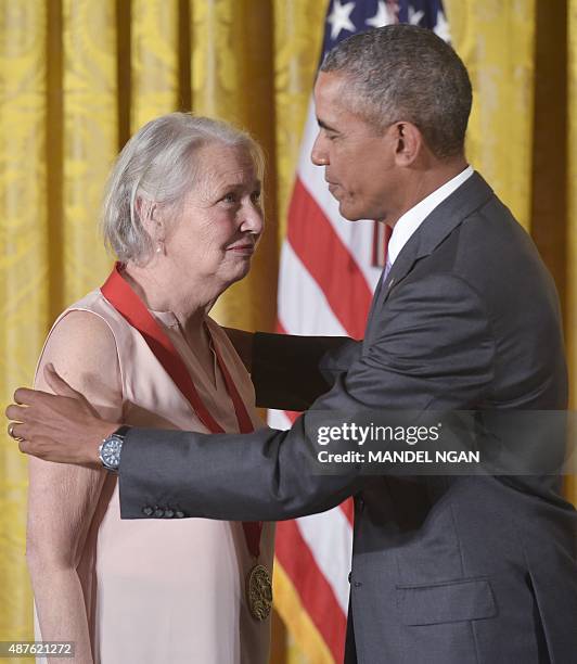 President Barack Obama presents the 2014 National Humanities Medal to author Annie Dillard during a ceremony in the East Room of the White House on...