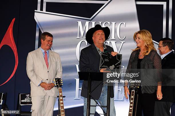 Karl Dean, Garth Brooks, and Tricia Yearwood attend an induction into the Nashville Walk Of Fame at Nashville Music City Walk of Fame on September...