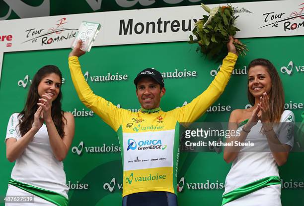 Michael Albasini of Switzerland and Orica GreenEdge receives the crowds applause on the podium after victory during stage two and claiming the yellow...