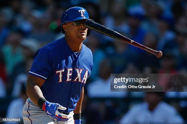 Adrian Beltre of the Texas Rangers flips his bat after swinging and missing in the ninth inning against the Seattle Mariners at Safeco Field on...