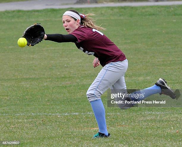 Windham's Taylor Tibbetts just misses catching a line drive as McAuley high school softball hosts Windham HS.