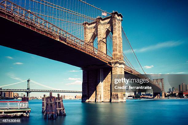 under the brooklyn bridge in new york city - brooklyn bridge stock pictures, royalty-free photos & images