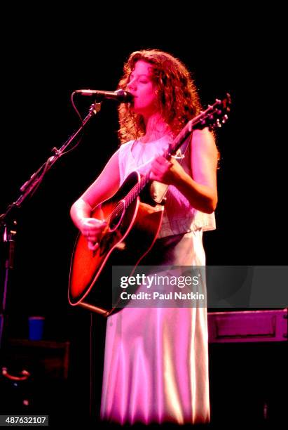 Canadian musician Sarah McLachlan plays guitar as she performs onstage, Chicago, Illinois, August 3, 1995.