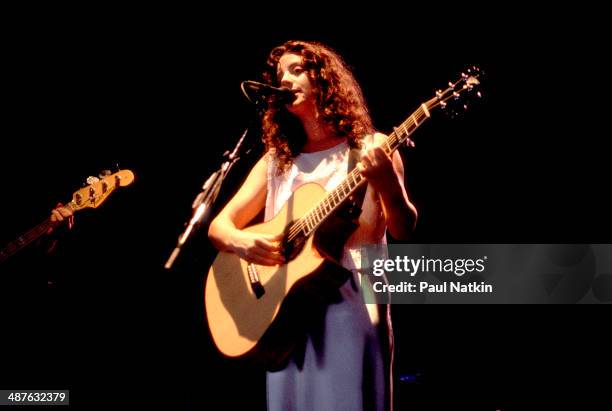 Canadian musician Sarah McLachlan plays guitar as she performs onstage, Chicago, Illinois, August 3, 1995.