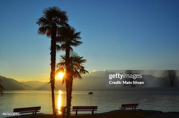 sunset over an alpine lake - locarno stock pictures, royalty-free photos & images