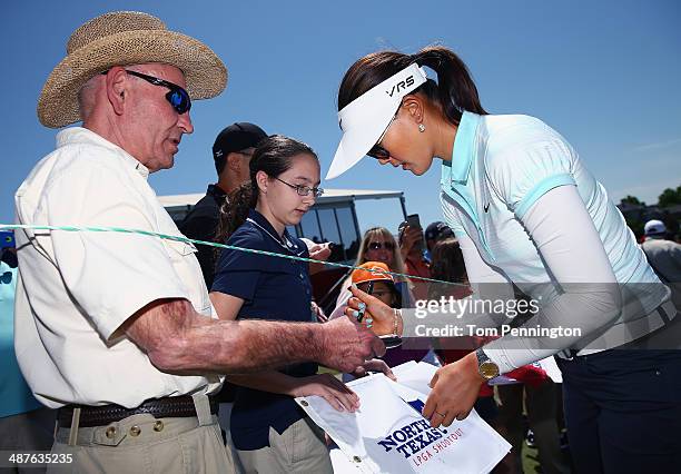 Michelle Wie signs autographs for fans after finishing Round One of the North Texas LPGA Shootout Presented by JTBC at the Las Colinas Country Club...