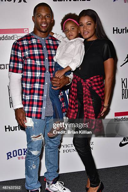 Wide receiver Victor Cruz, daughter Kennedy Cruz, and wife Elaina Watley attend the Kids Rock! show during New York Fashion Week at The Dock,...