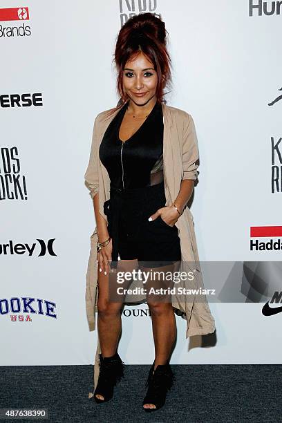 Nicole Elizabeth "Snooki" LaValle poses backstage at the Kids Rock! fashion show during Spring 2016 New York Fashion Week: The Shows at The Dock,...