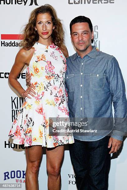 Alysia Reiner and David Alan Basche pose backstage at the Kids Rock! fashion show during Spring 2016 New York Fashion Week: The Shows at The Dock,...