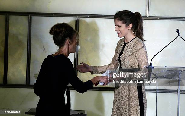 Robbie Myers receives an award from Anna Kendrick on stage during The Daily Front Row's Third Annual Fashion Media Awards at the Park Hyatt New York...