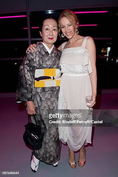 Setsuko de Rola and kylie Minogue attend the Auction Dinner to Benefit 'Institiut Imagine' on September 10, 2015 in Paris, France.
