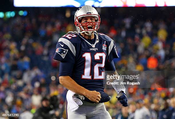 Tom Brady of the New England Patriots cheers as he runs on to the field before the game against the Pittsburgh Steelers at Gillette Stadium on...