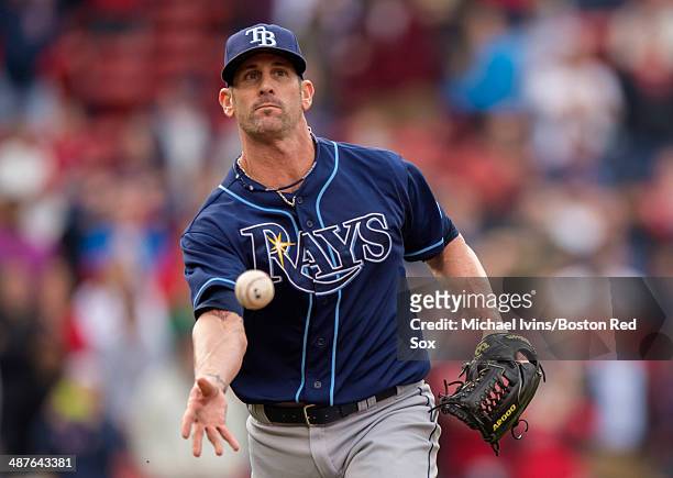 Grand Balfour of the Tampa Bay Rays underhands to first to get the final out against the Boston Red Sox in the ninth inning of the first game of a...
