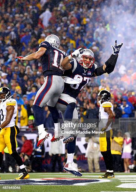 Rob Gronkowski of the New England Patriots celebrates with Julian Edelman after Gronkowski's second touchdown of the game in the second quarter...