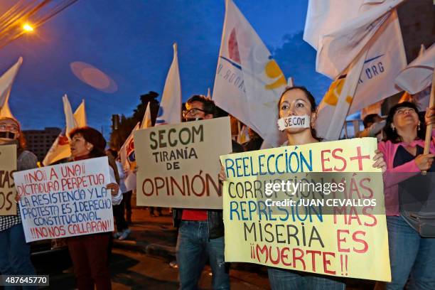 Activists of the NGO Fundamedios gather outside Ecuador's National Secretariat of Communications to protest against the governments' move to dissolve...