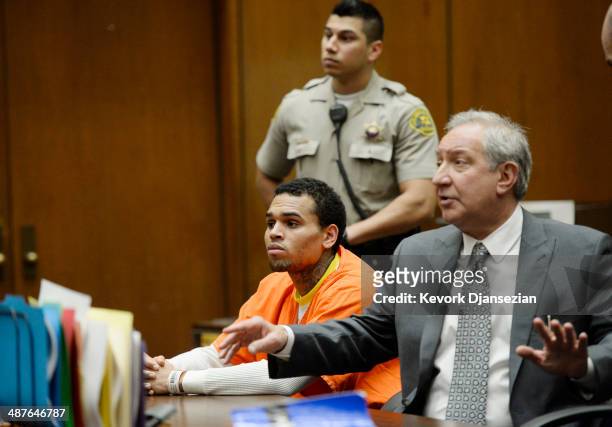 Singer Chris Brown appears in court for a probation violation hearing with his attorney Mark Geragos in Los Angeles Superior Court on May 1, 2014 in...